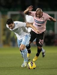 Lazio's midfielder Anderson Hernanes (L) fights for the ball with Palermo's midfielder Arevalo Rios on January 19, 2013